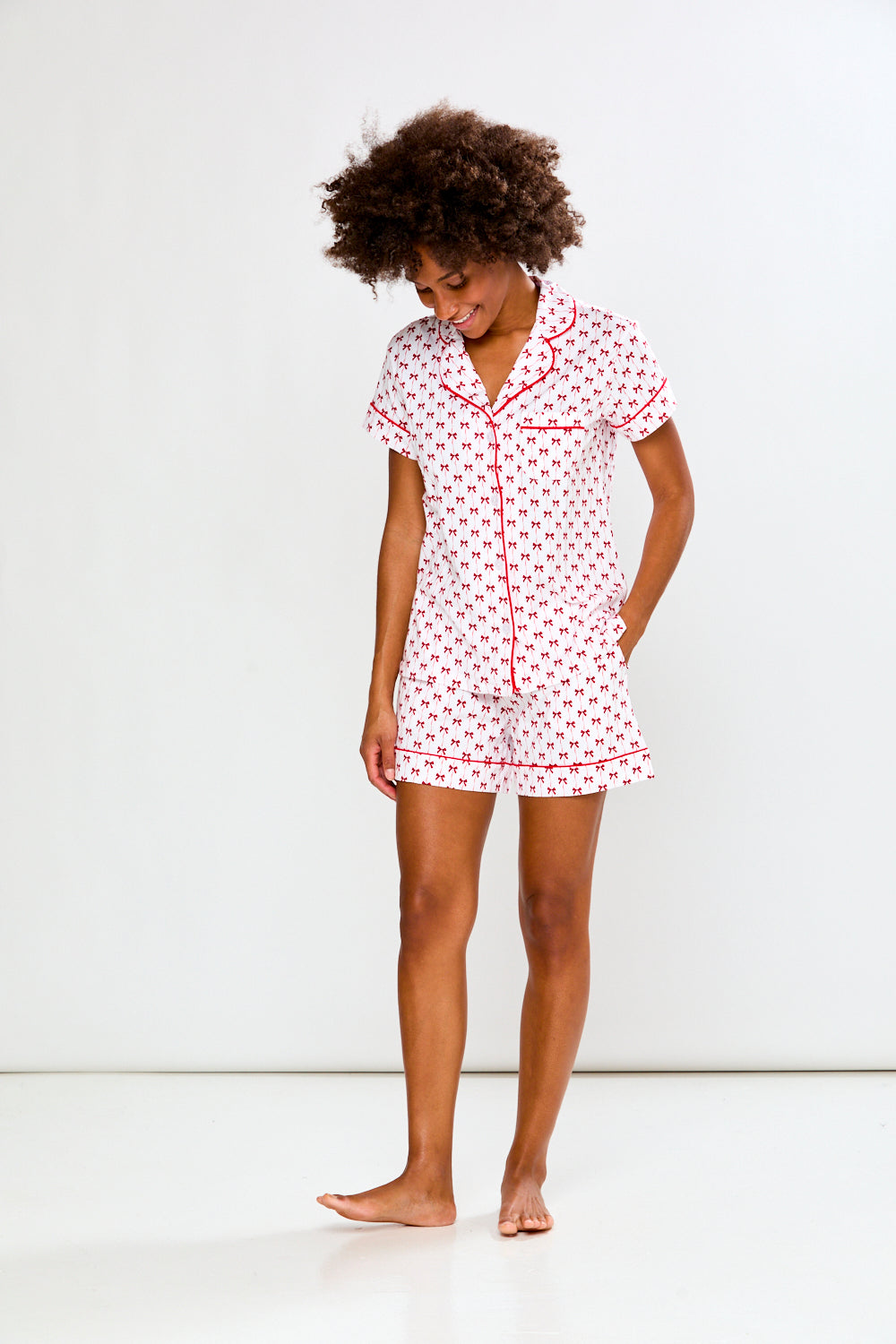 Woman in bow printed pajamas