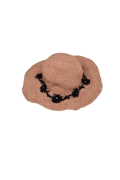 Beige straw hat with black floral details on a white background