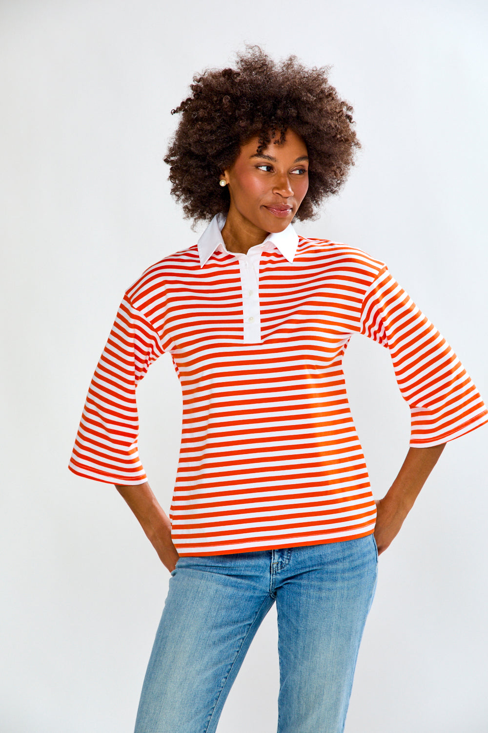 Woman in Orange & White Stripe top