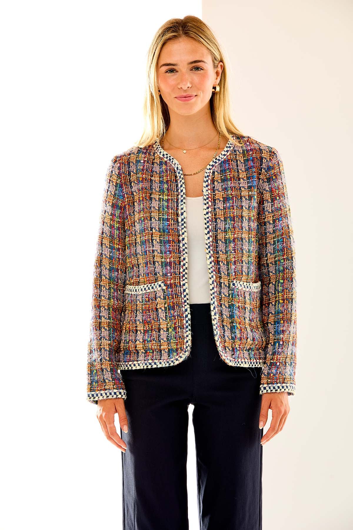 Woman in multi tweed jacket