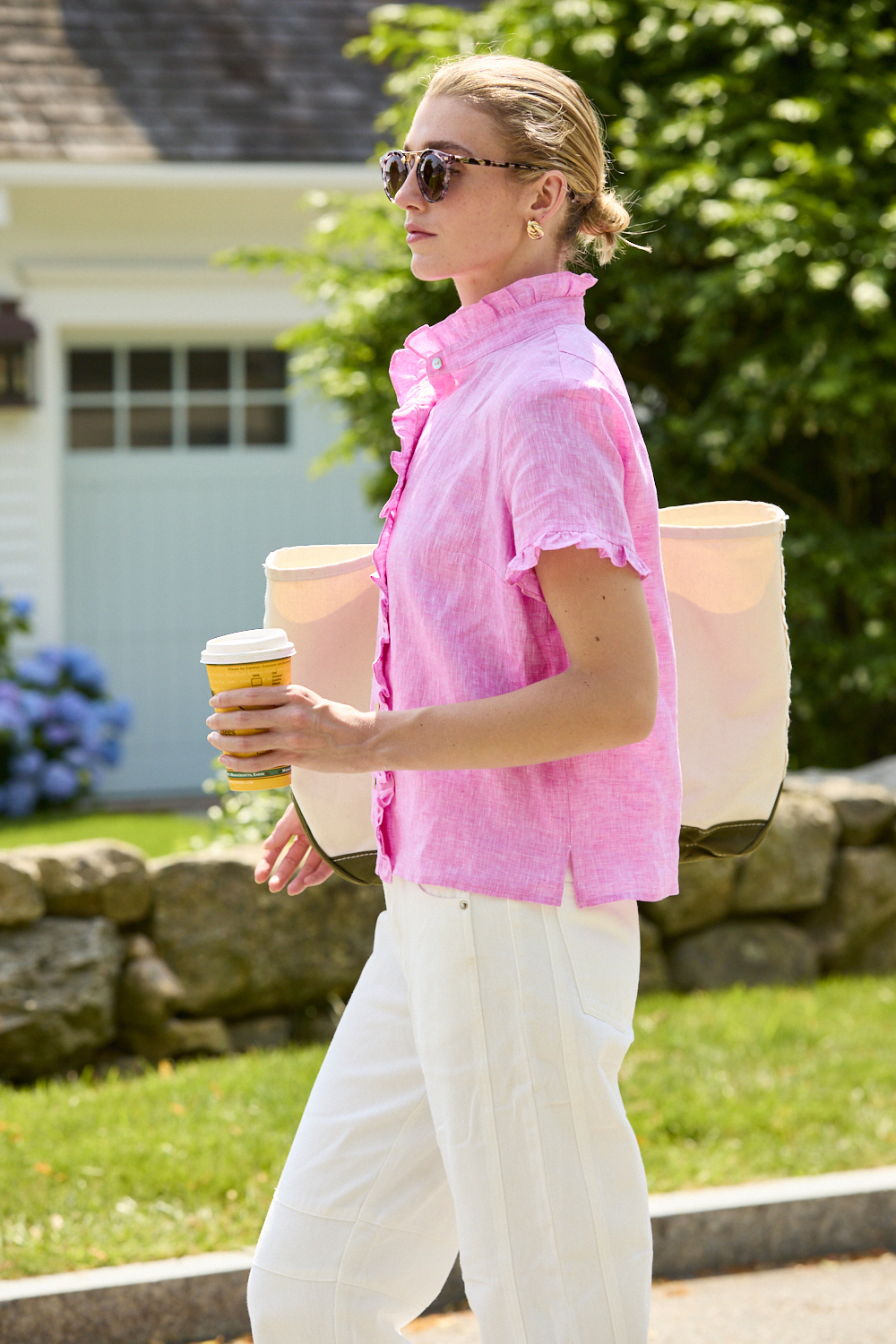 Woman wearing a pink linen blouse