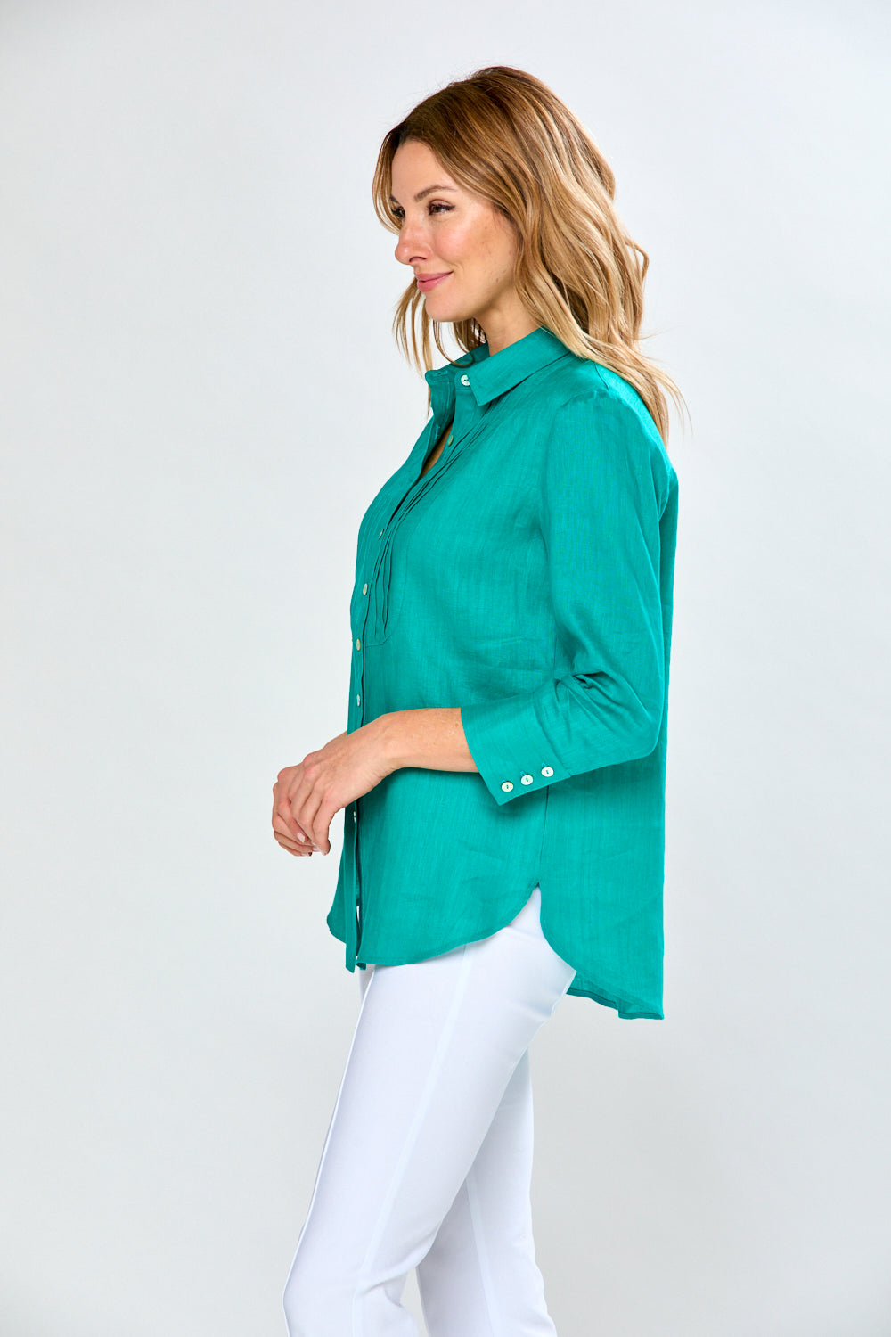 Woman in teal blouse