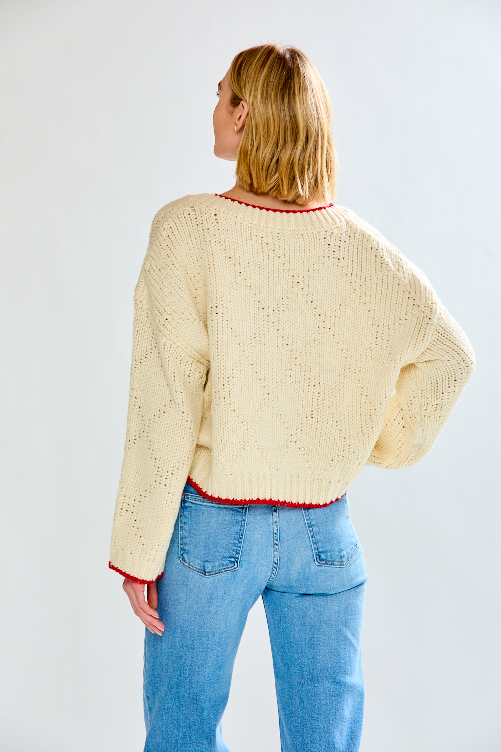 Woman with cream fish sweater on