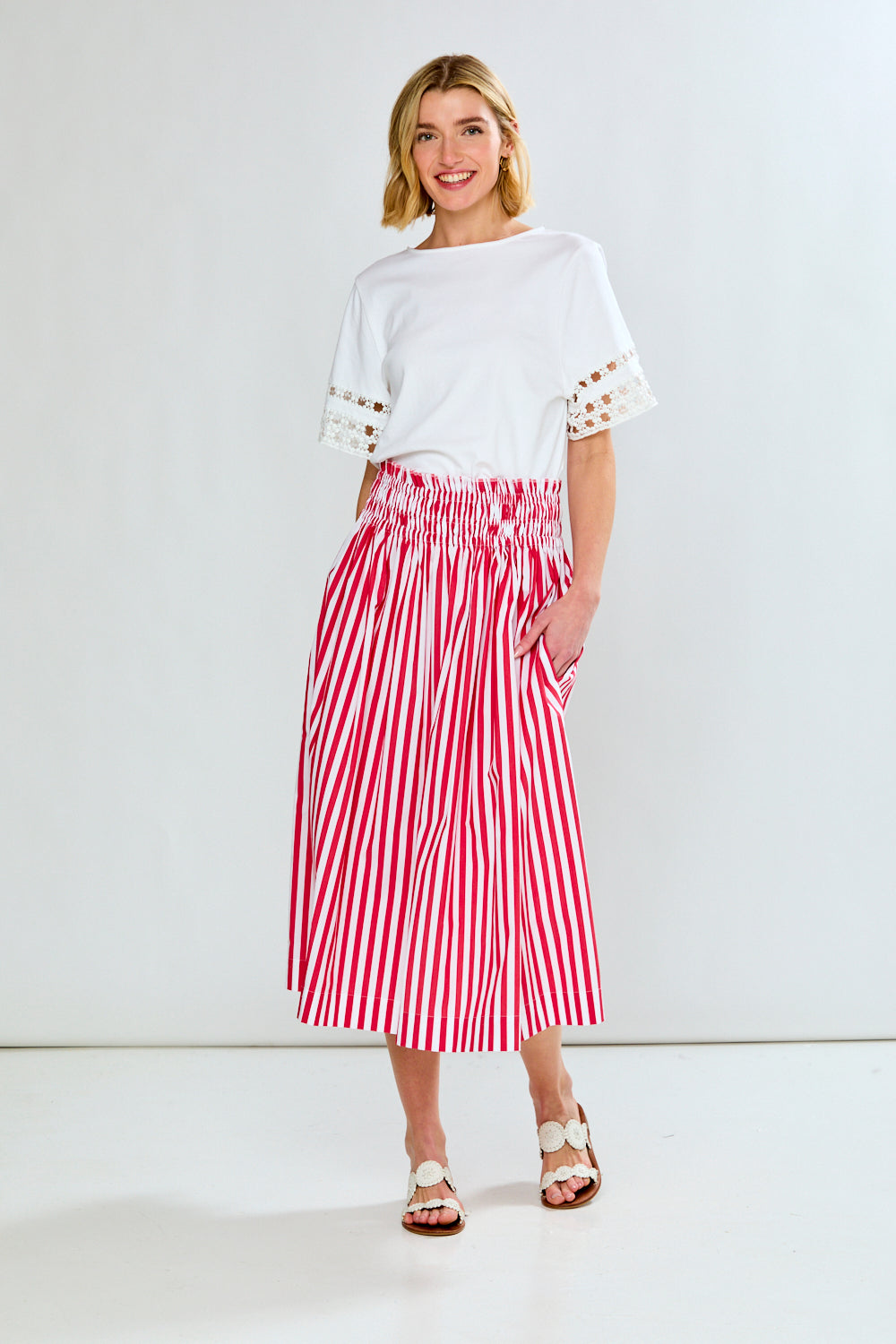 Woman in red & white stripe skirt