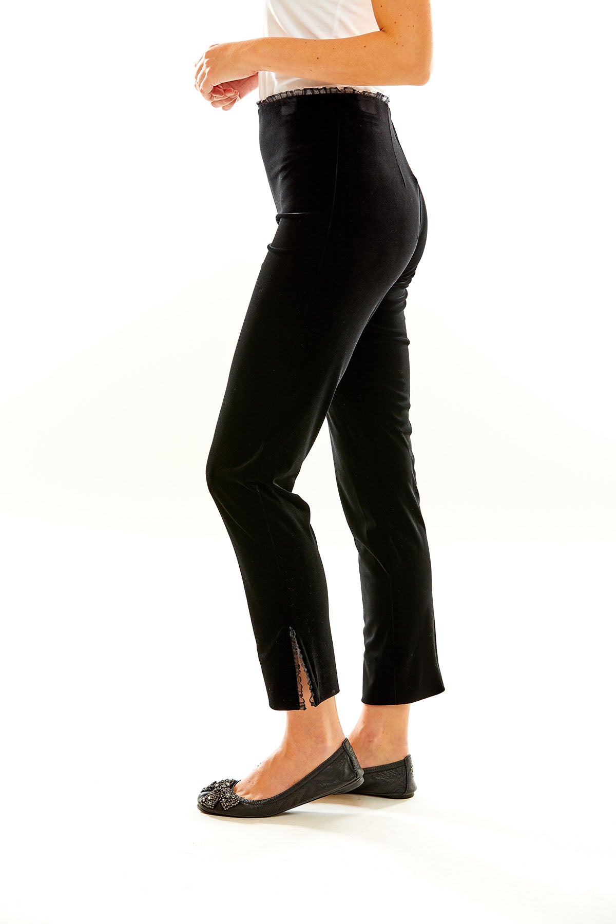 Woman in black velvet pants