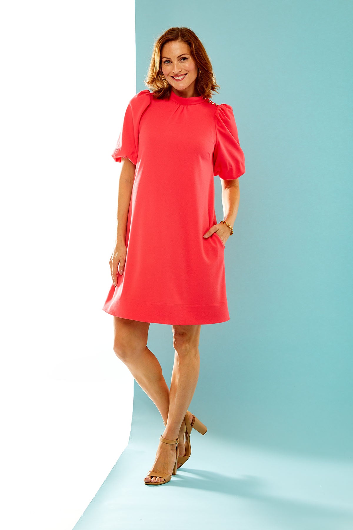 Woman in coral dress