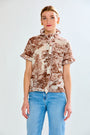 woman in brown toile top