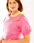 Woman in peony dress with puff sleeves