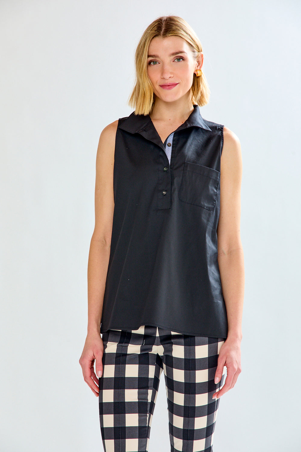 Woman in black sleeveless top