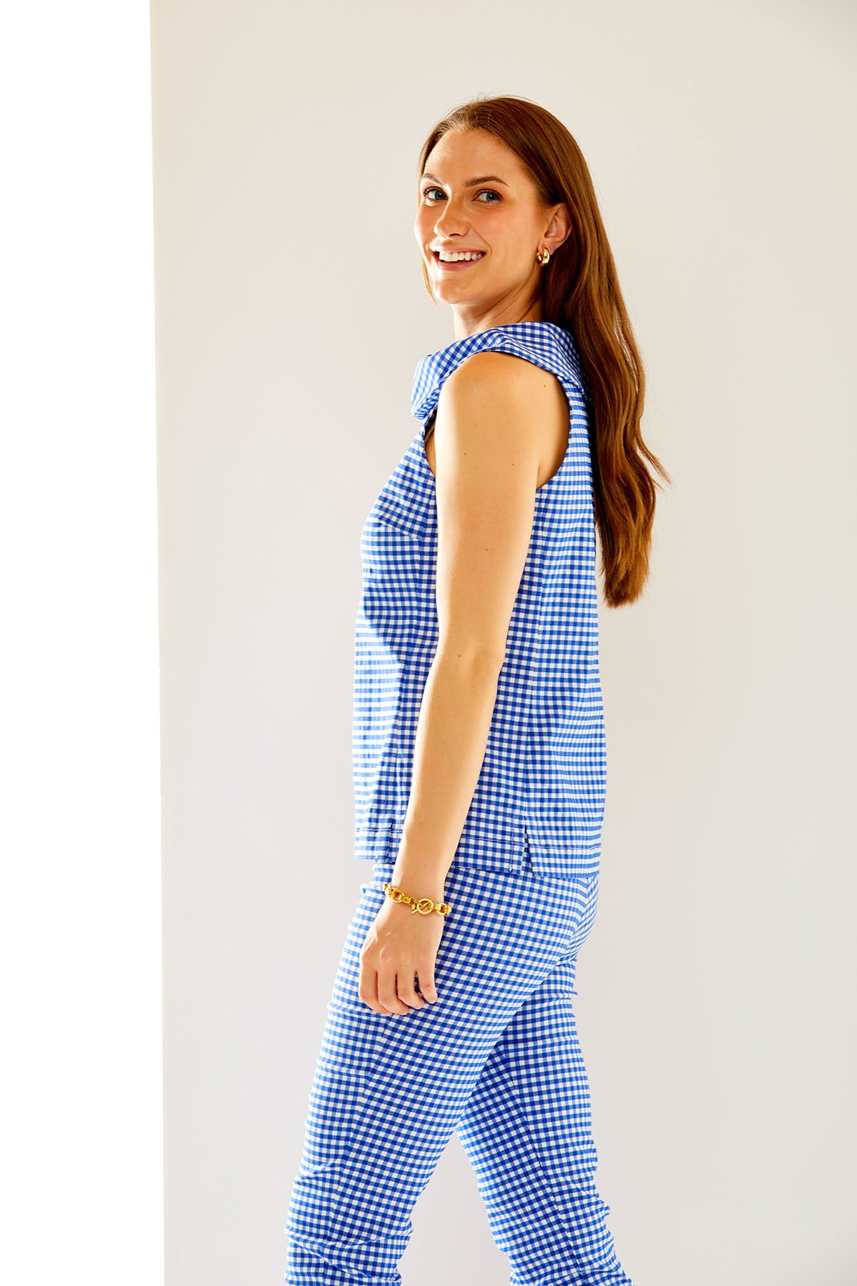 Woman in blue and white gingham top