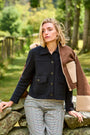 Woman wearing a black sweater jacket with pockets