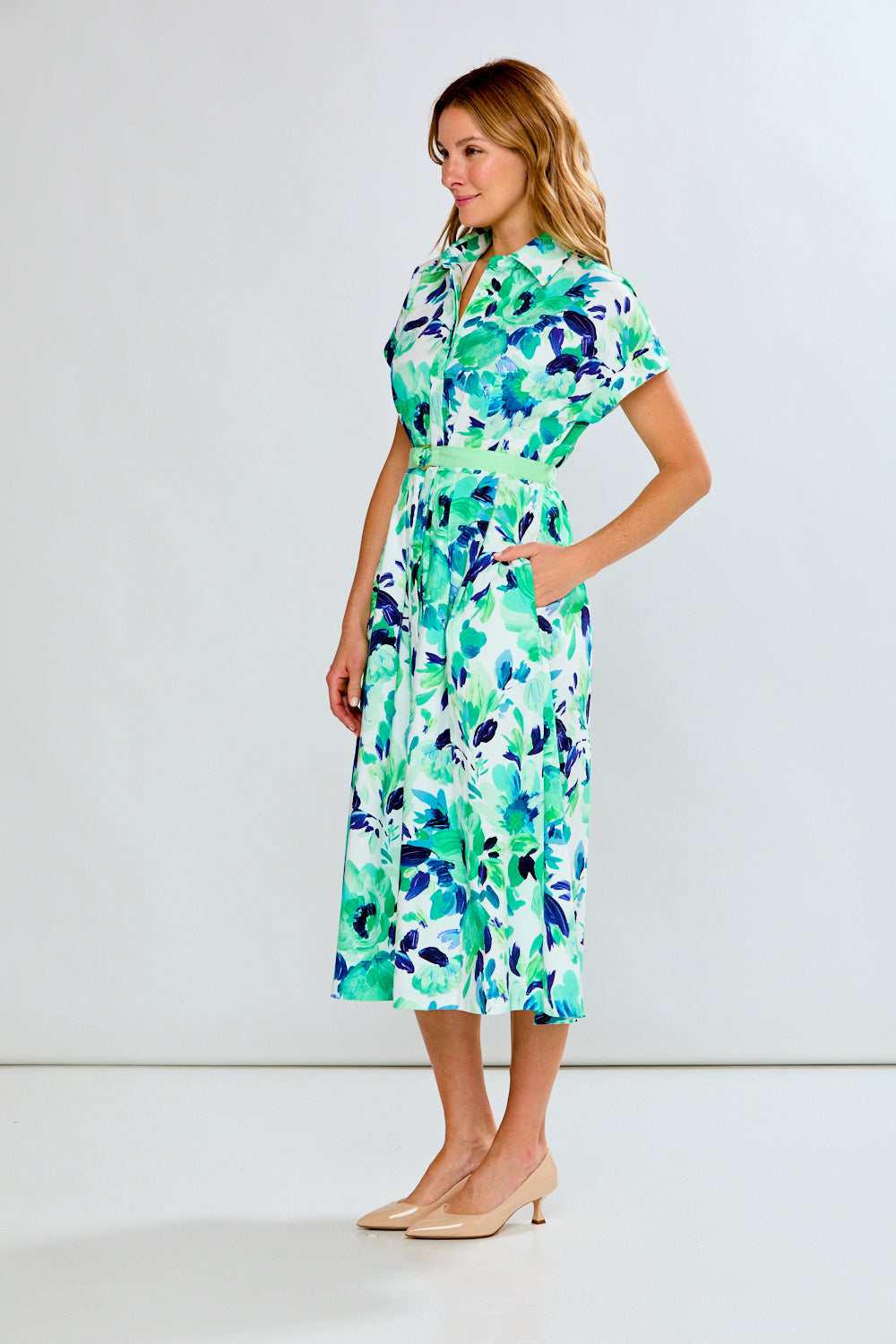 woman in green floral dress