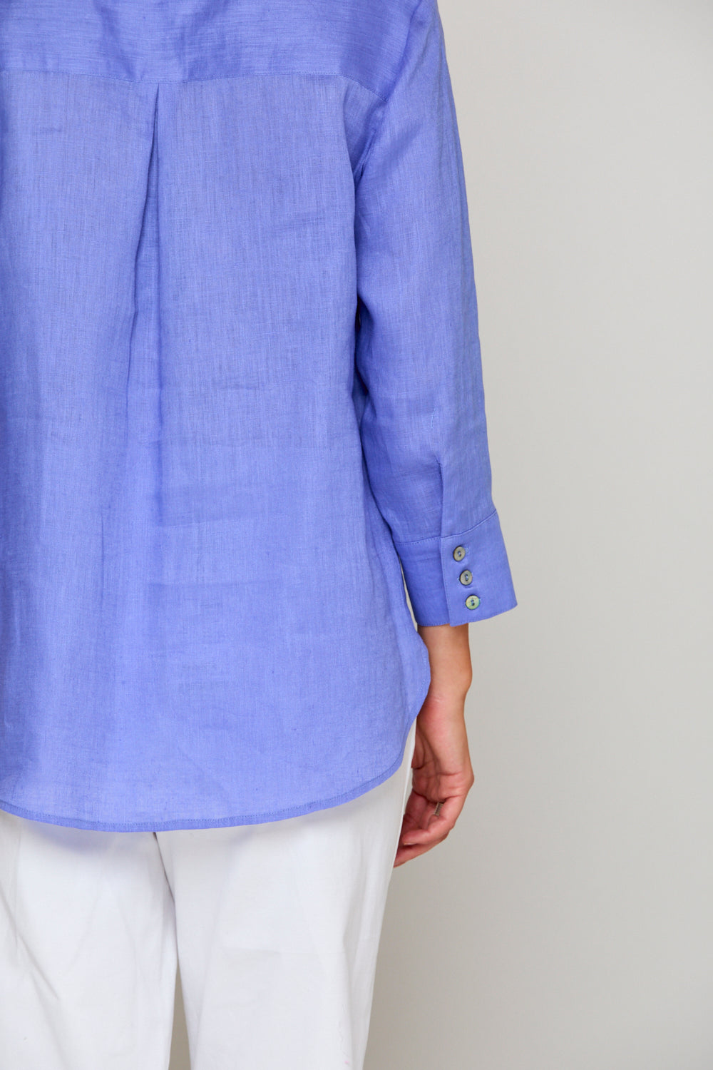 Woman in periwinkle blouse