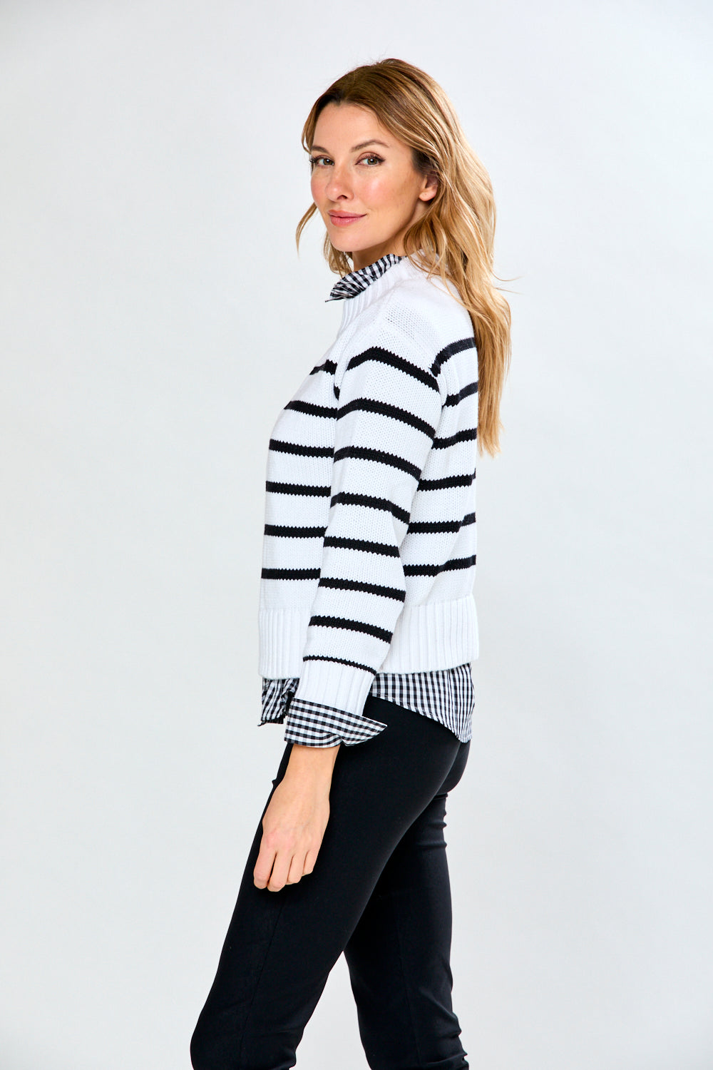 Woman in black/white sweater