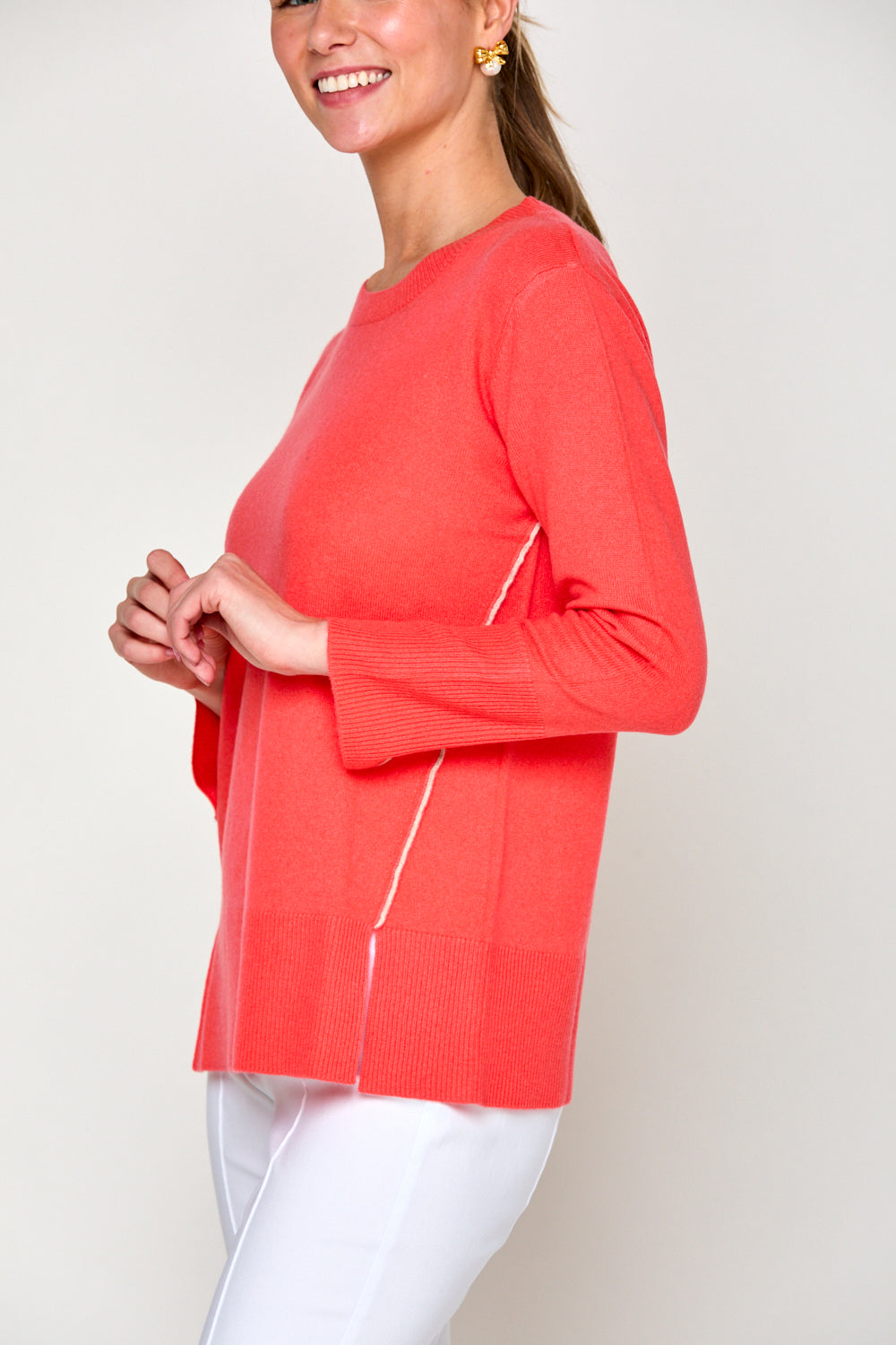 Woman in coral sweater