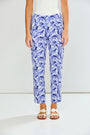 Person wearing blue floral pants on a white background
