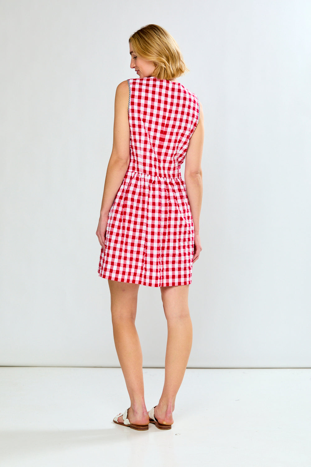 woman in red check dress