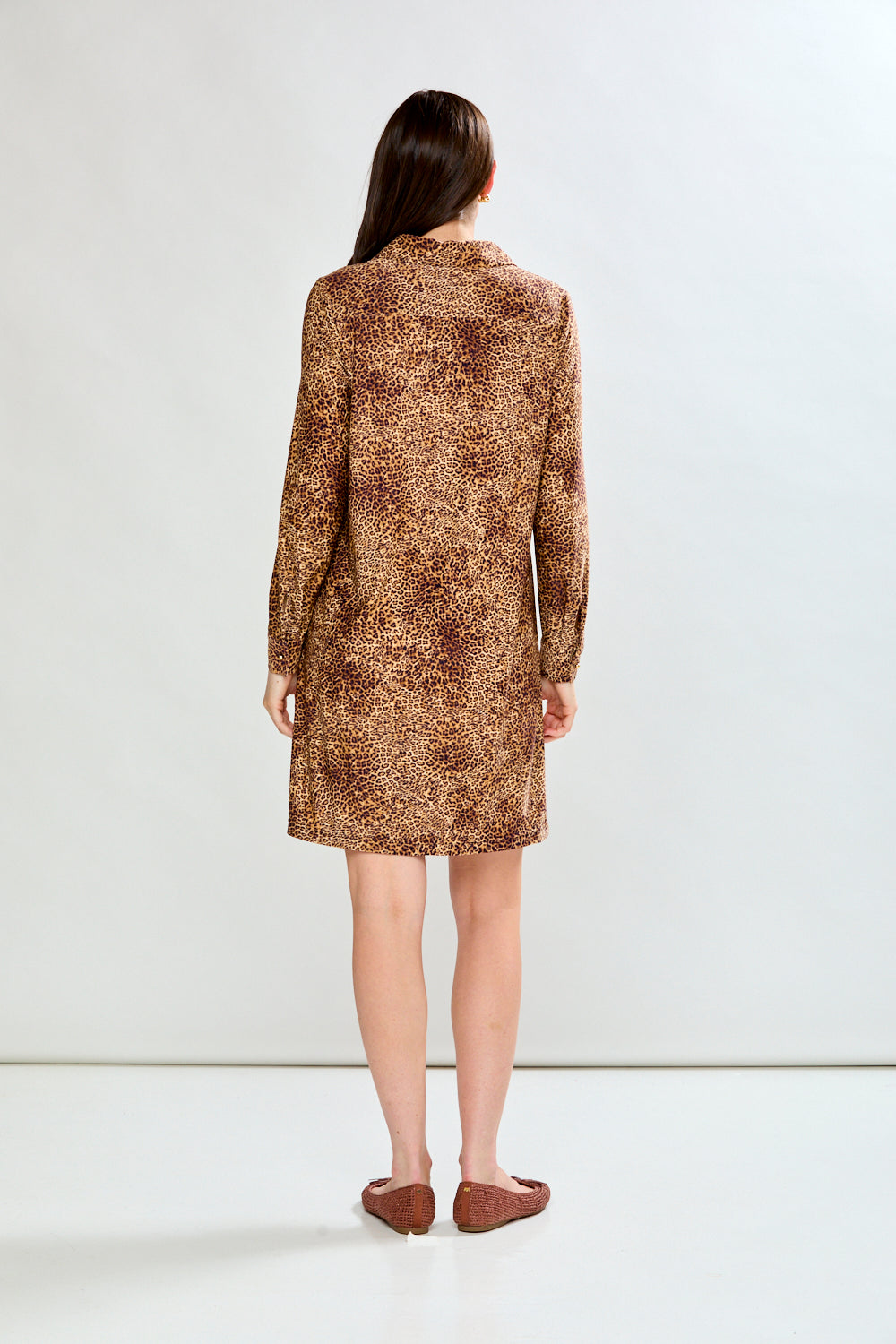Woman in animal print dress