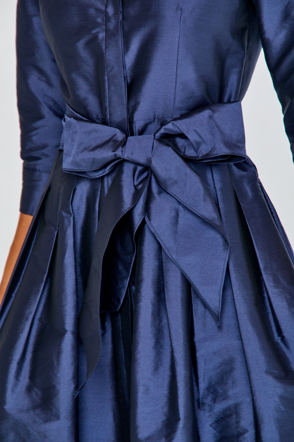 Woman in navy long taffeta dress