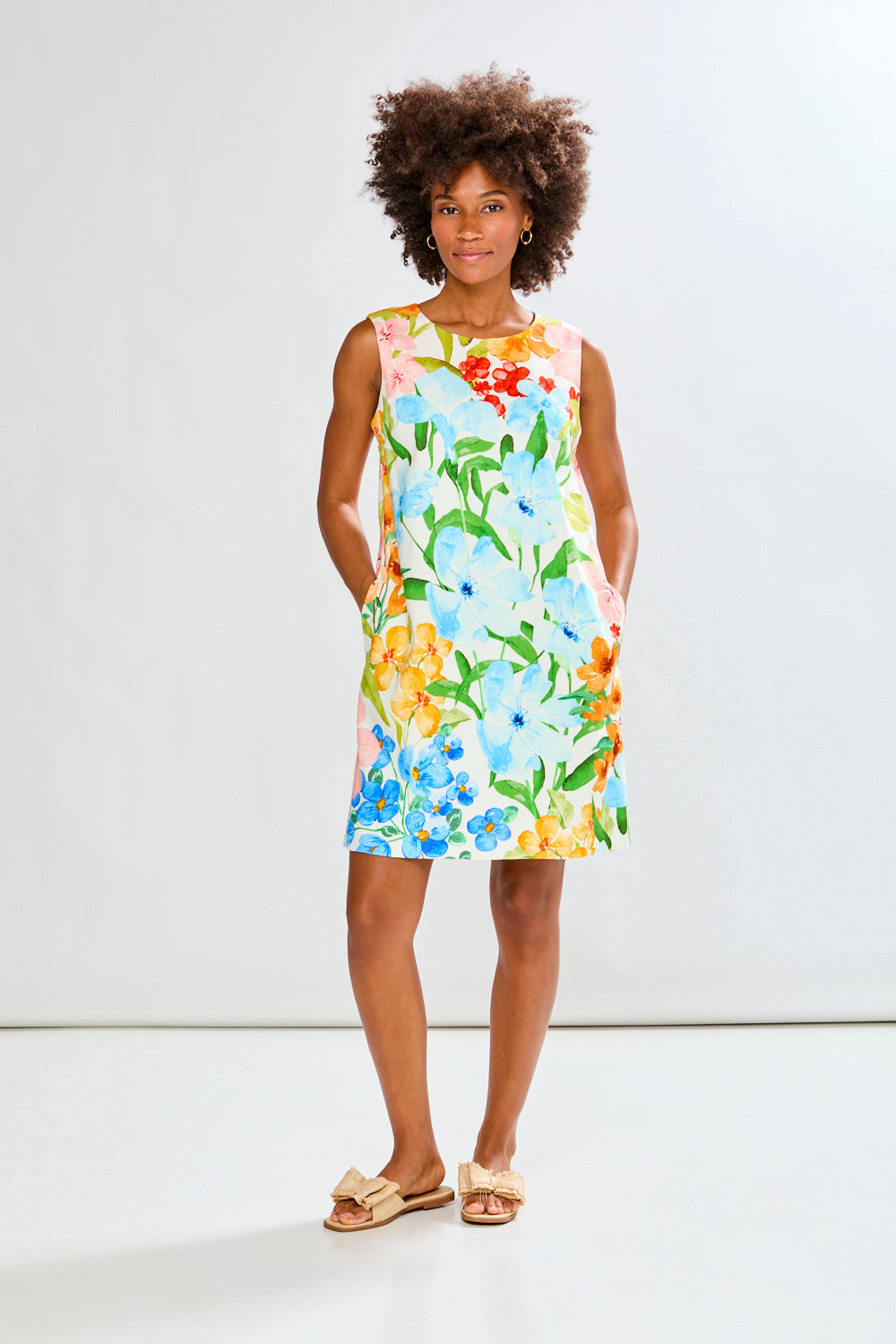 Woman wearing The Sleeveless Rue Dress in Tropical Blooms in Tropical Blooms