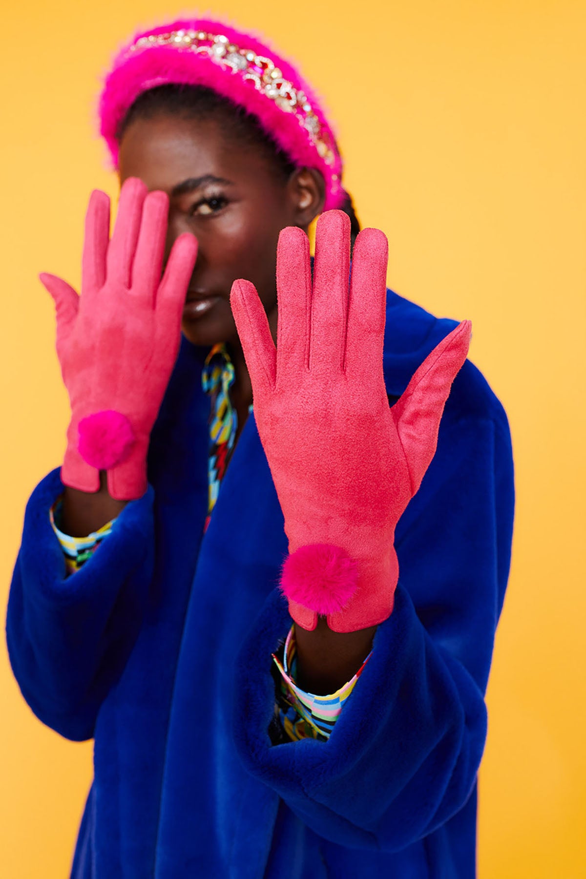 Woman in hot pink faux suede faux fur gloves