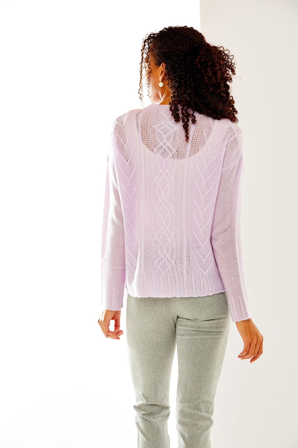 Woman in haze cable pullover
