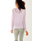 Woman in haze cable pullover