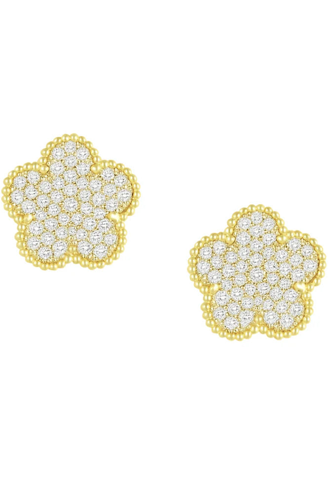 Gold flower-shaped earrings with clear gemstones on a white background