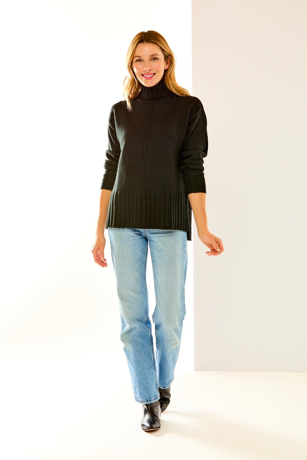 Woman in black cashmere turtleneck