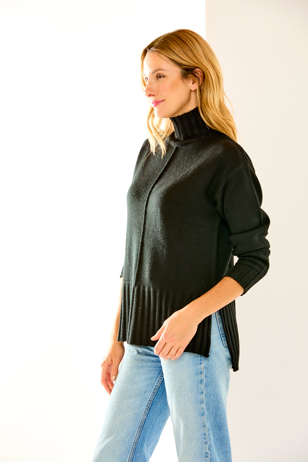 Woman in black cashmere turtleneck