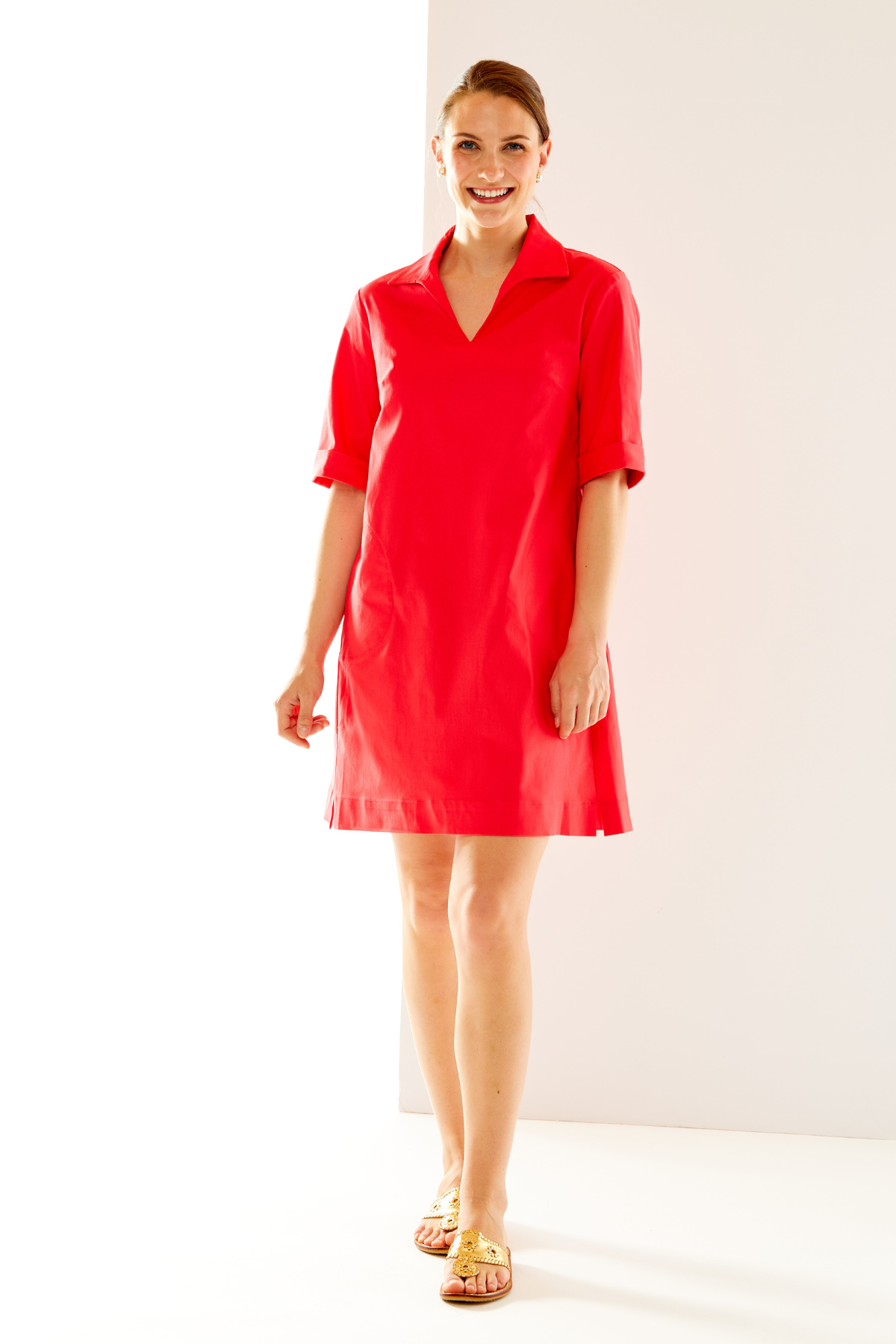 Woman in coral short sleeve dress