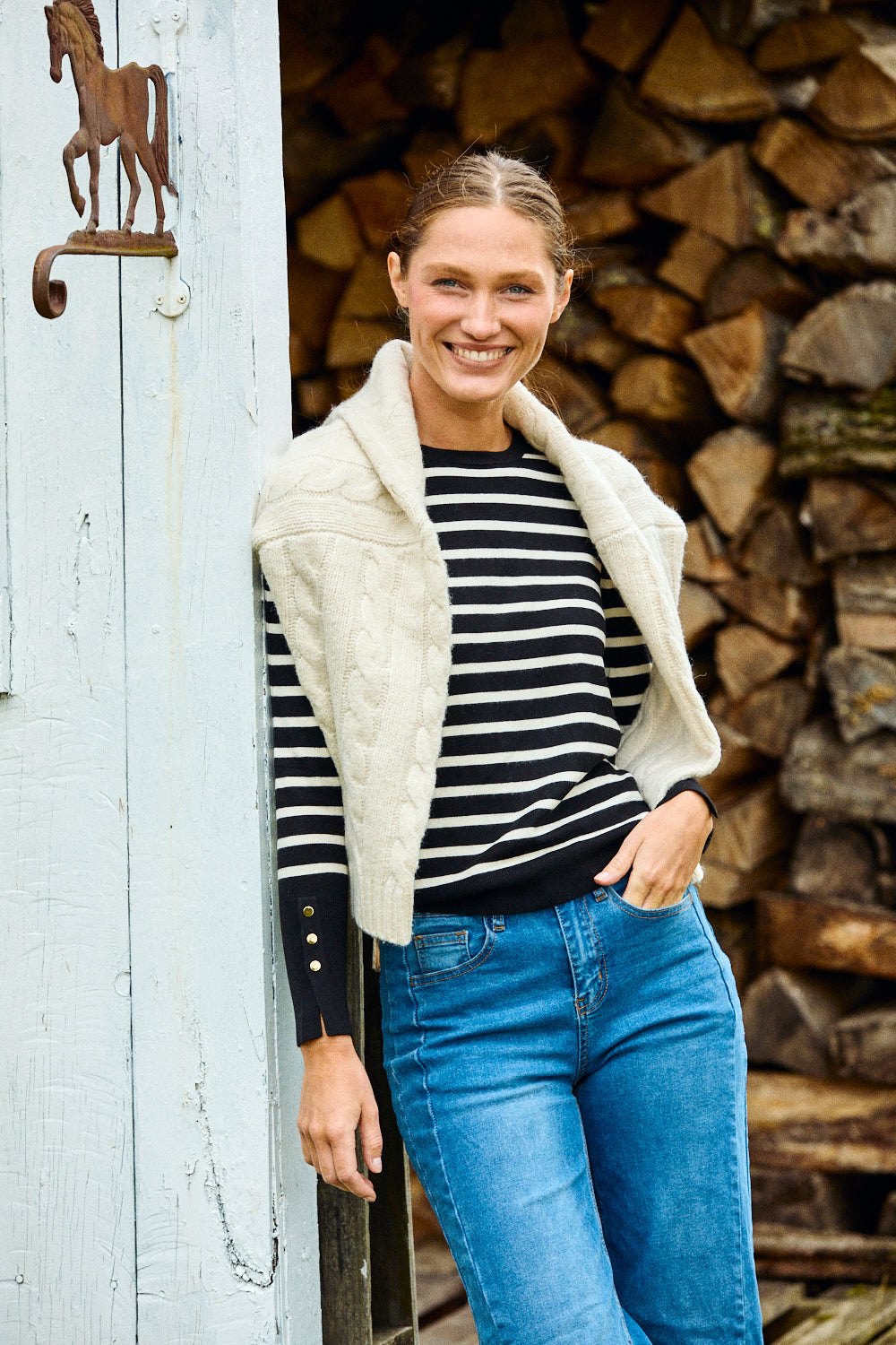 Woman wearing black and white stripe sweater