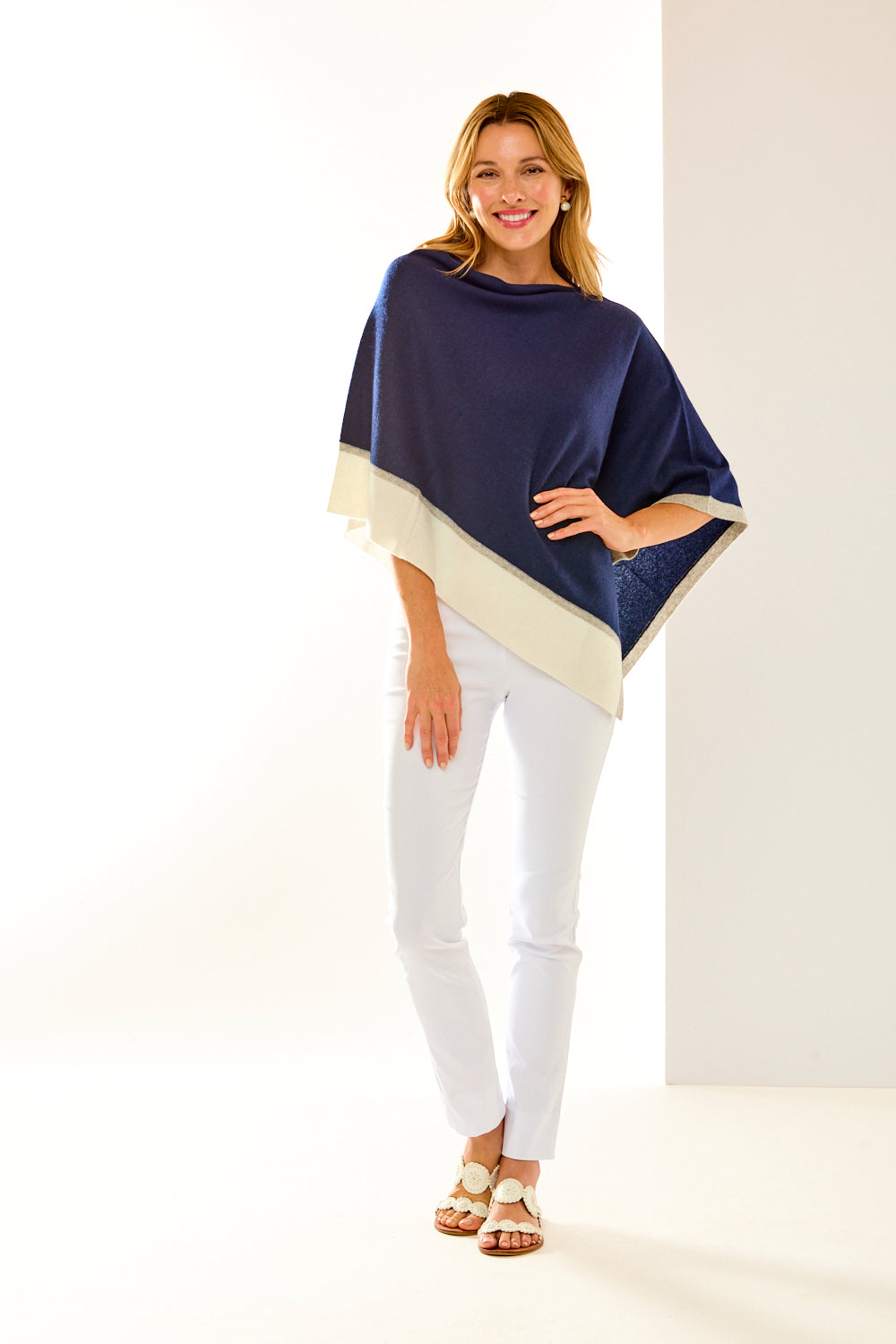 Woman in navy cashmere ruana