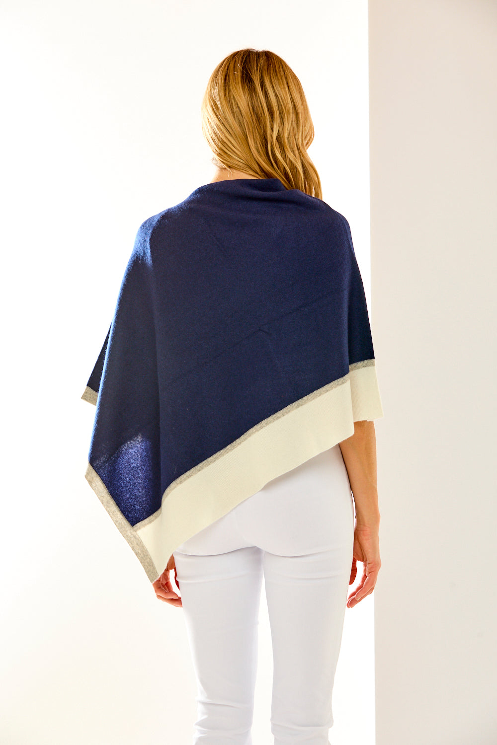 Woman in navy cashmere ruana