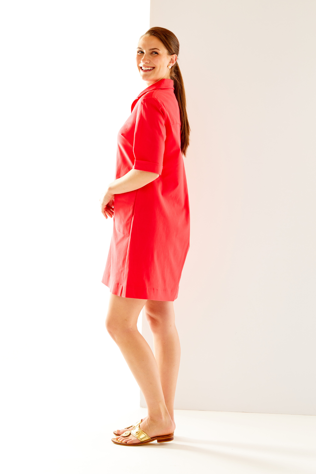 Woman in coral short sleeve dress
