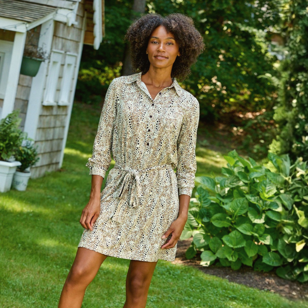 A woman wearing The Katrina Dress in Brown/Cream Leo