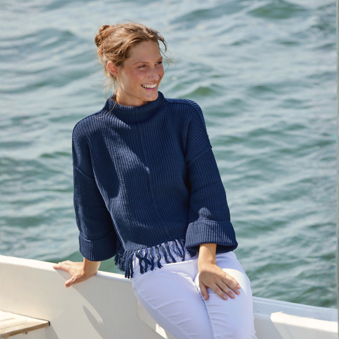 A woman wearing The Fringed Cotton Pullover in Navy