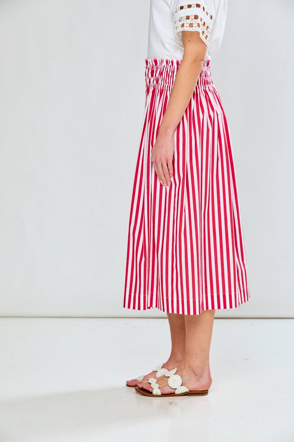Woman in red & white stripe skirt