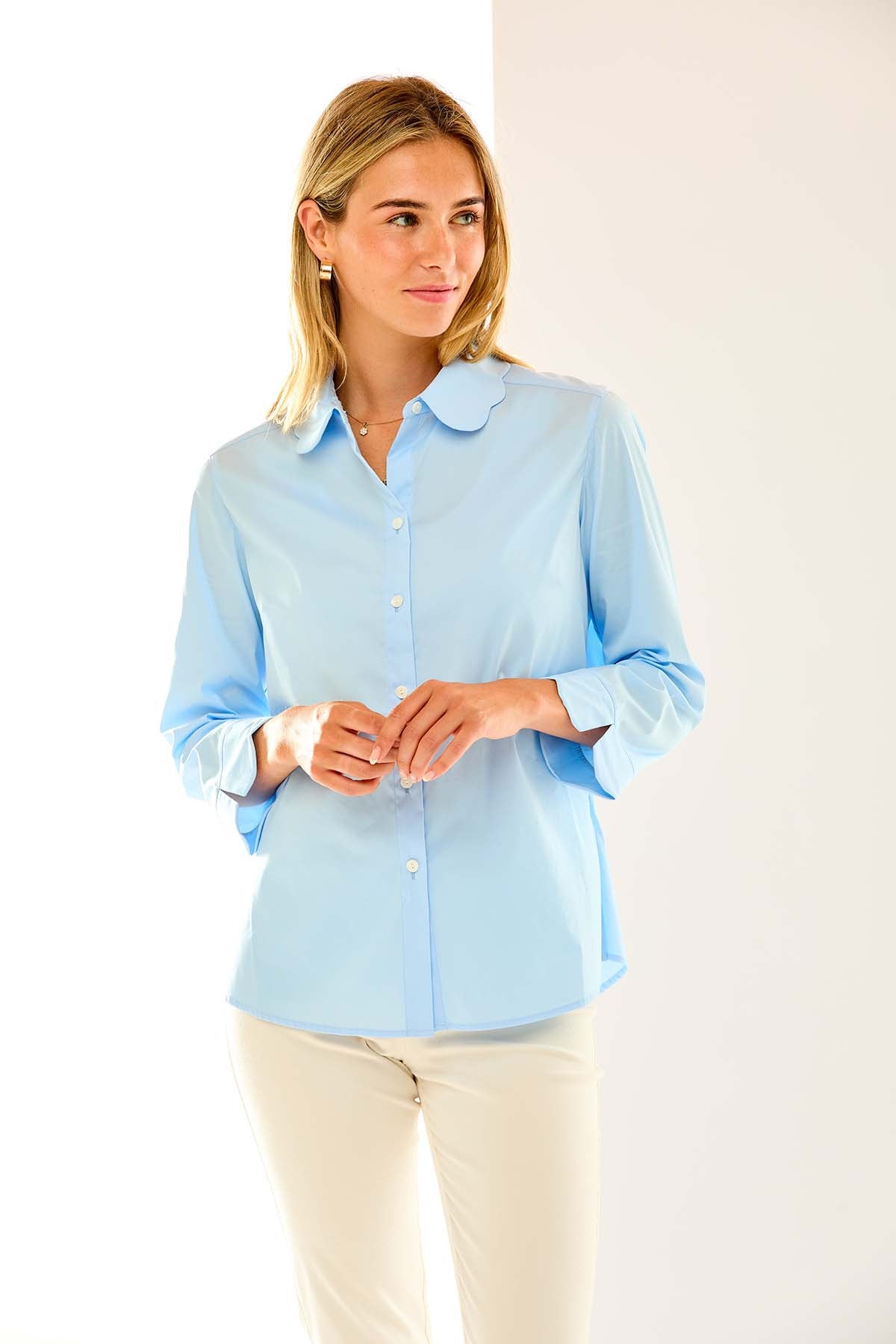 Woman in light blue button down shirt