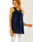 Woman in navy sleeveless top