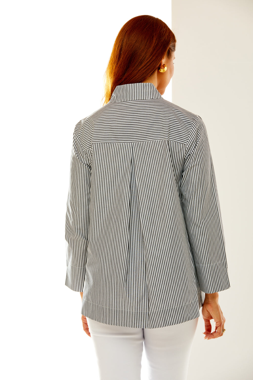 Woman in black and white stripe shirt