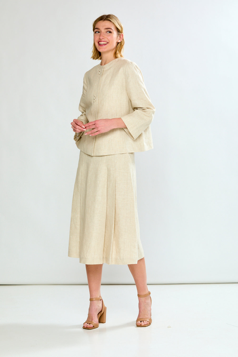 woman in light oatmeal coat