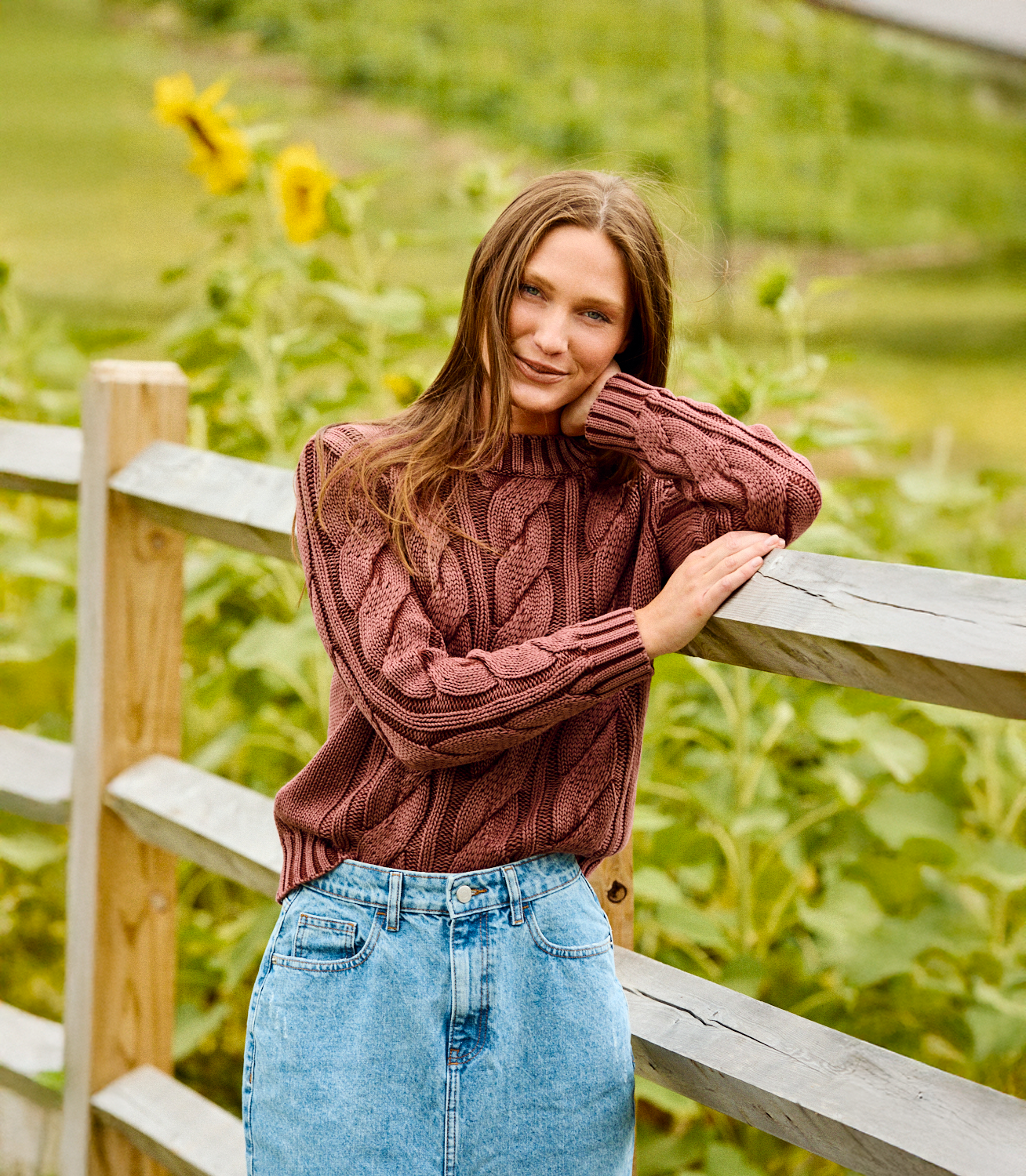Woman wearing a cable knit sweater
