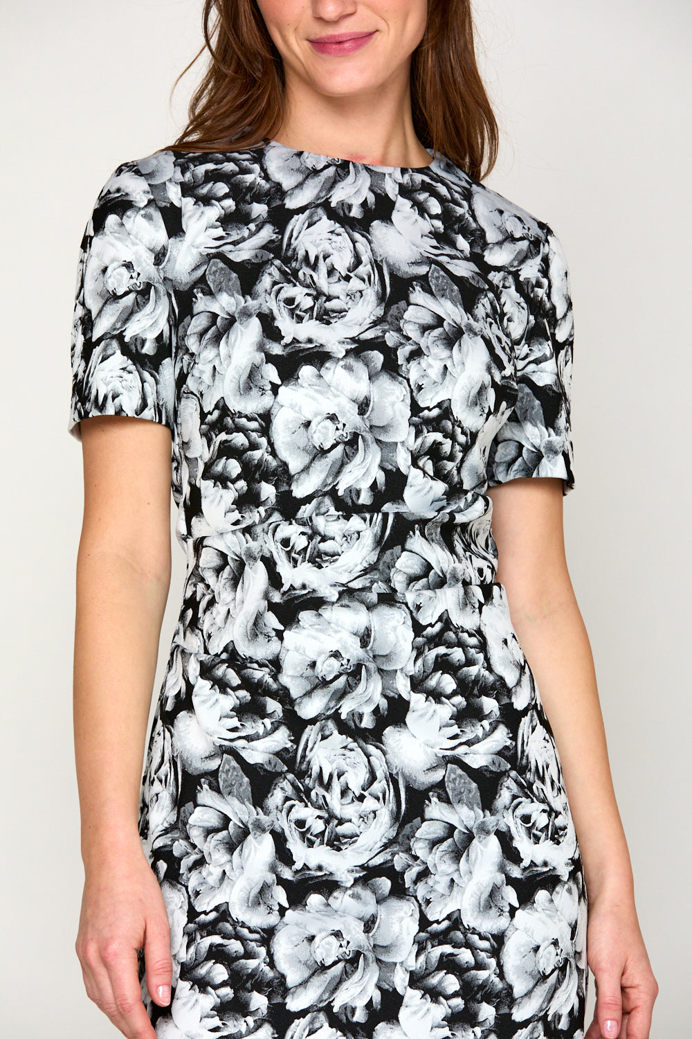 Woman in black roses dress