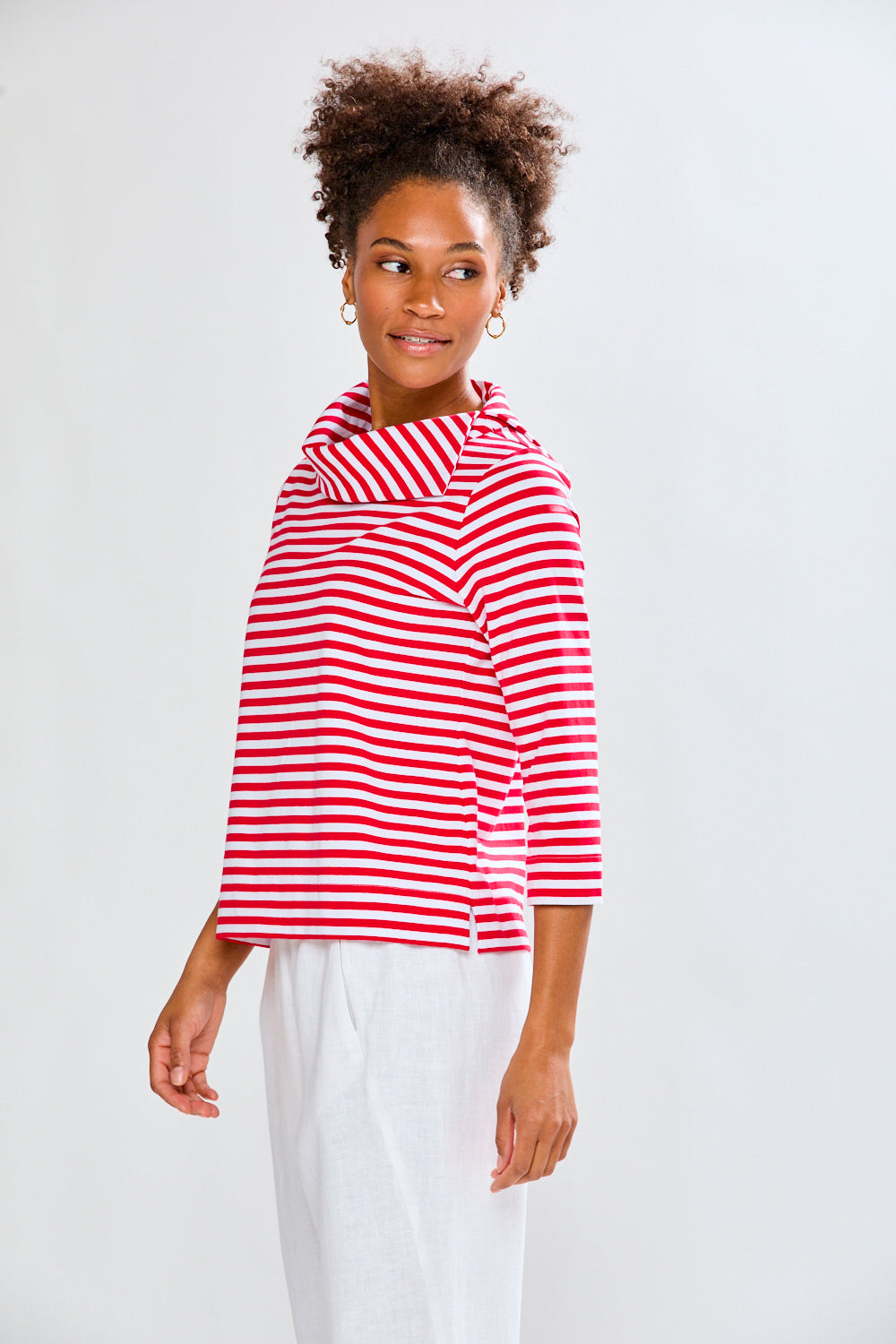 Woman in a white and red striped knit top