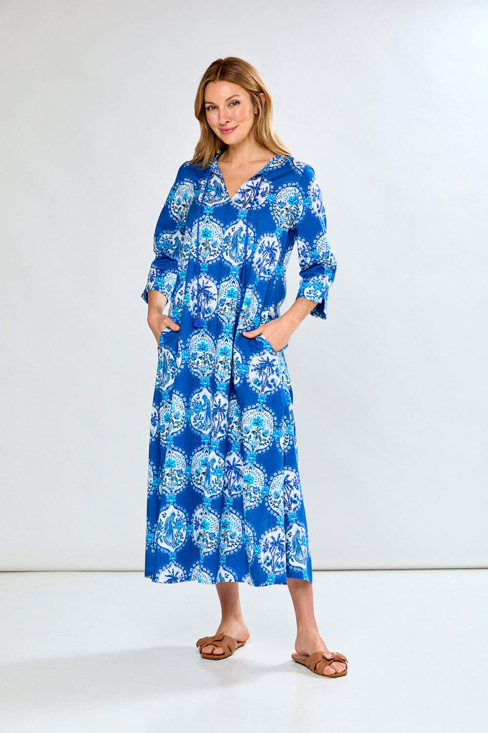 Woman in blue french tile caftan