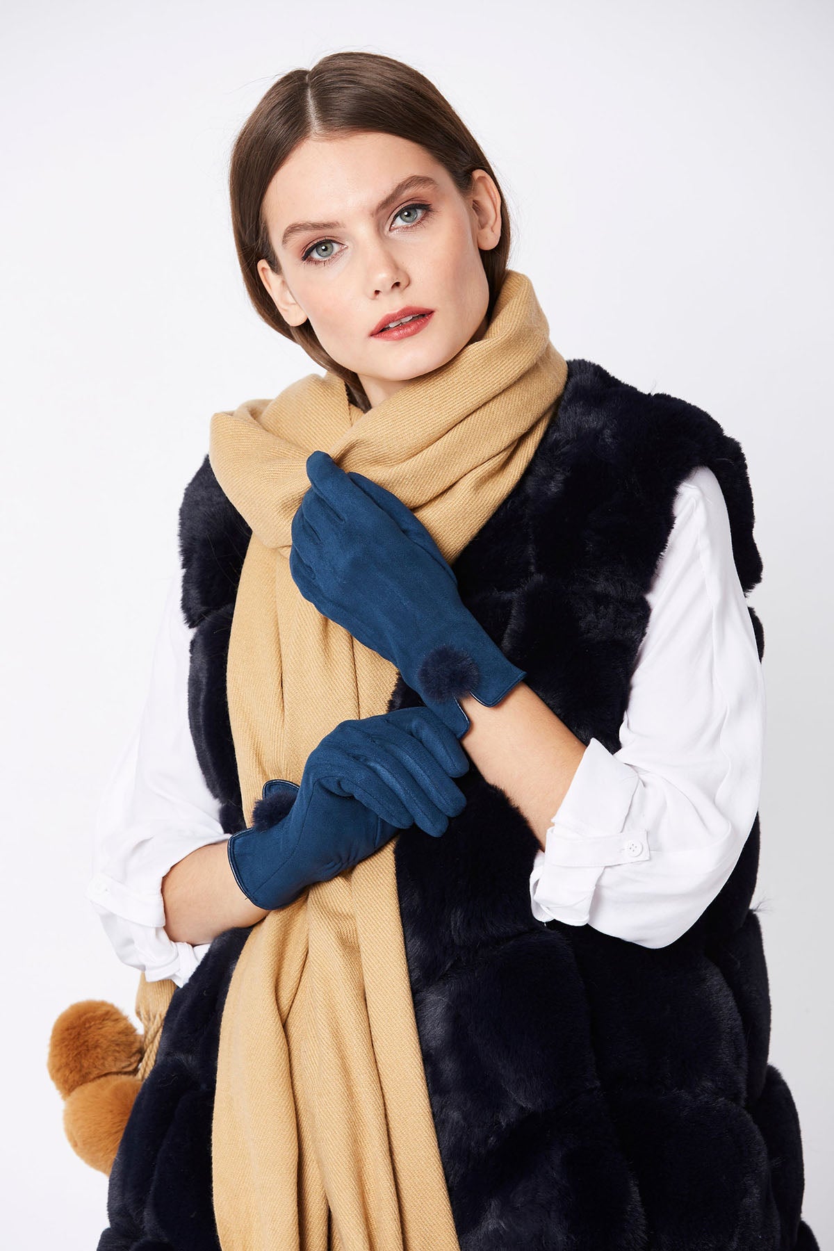 Woman in navy faux suede faux fur gloves