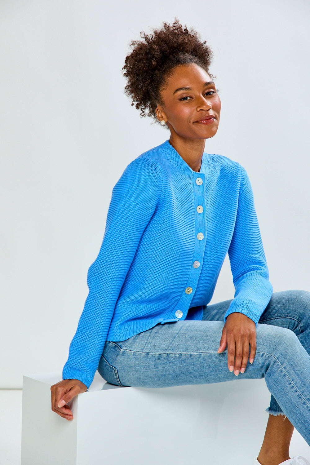 woman in periwinkle sweater