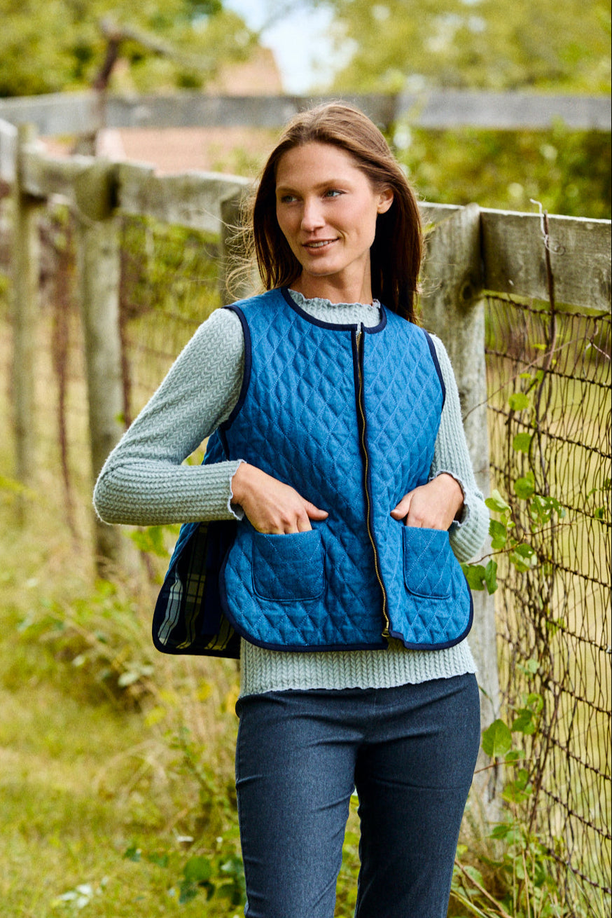 Woman wearing a navy vest