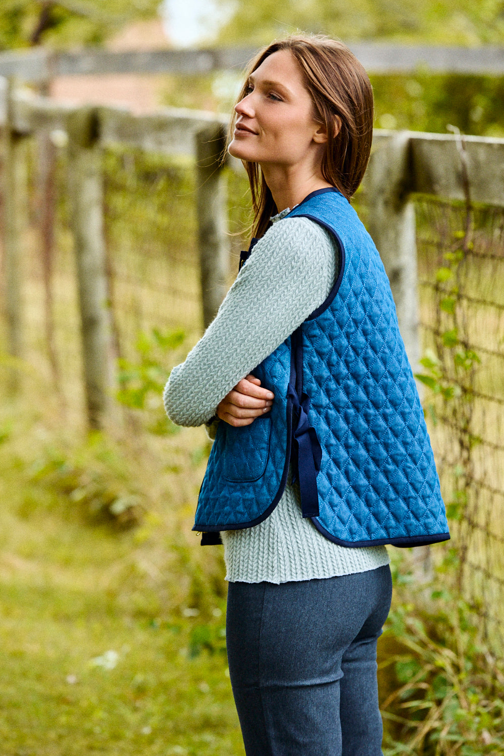 Woman wearing a blue vest